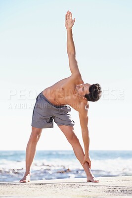 Buy stock photo Fitness, man and stretching body on beach for exercise, yoga or getting ready for workout or training in nature. Fit, active or muscular male yogi in warm up stretch, cardio or exercising by an ocean