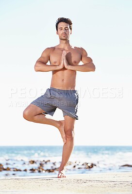 Buy stock photo Fitness, man and yoga in meditation on beach for exercise, spiritual wellness or inner peace in nature. Calm male yogi in tree pose for balance, healthy body or mindfulness and awareness on the ocean