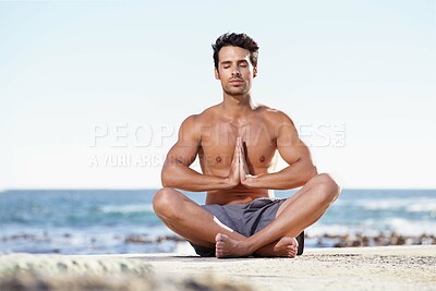 Buy stock photo Man, relax and yoga in meditation on beach for spiritual wellness, inner peace or mental wellbeing in nature. Calm male yogi in meditate pose for balance, healthy body or mindfulness by the ocean