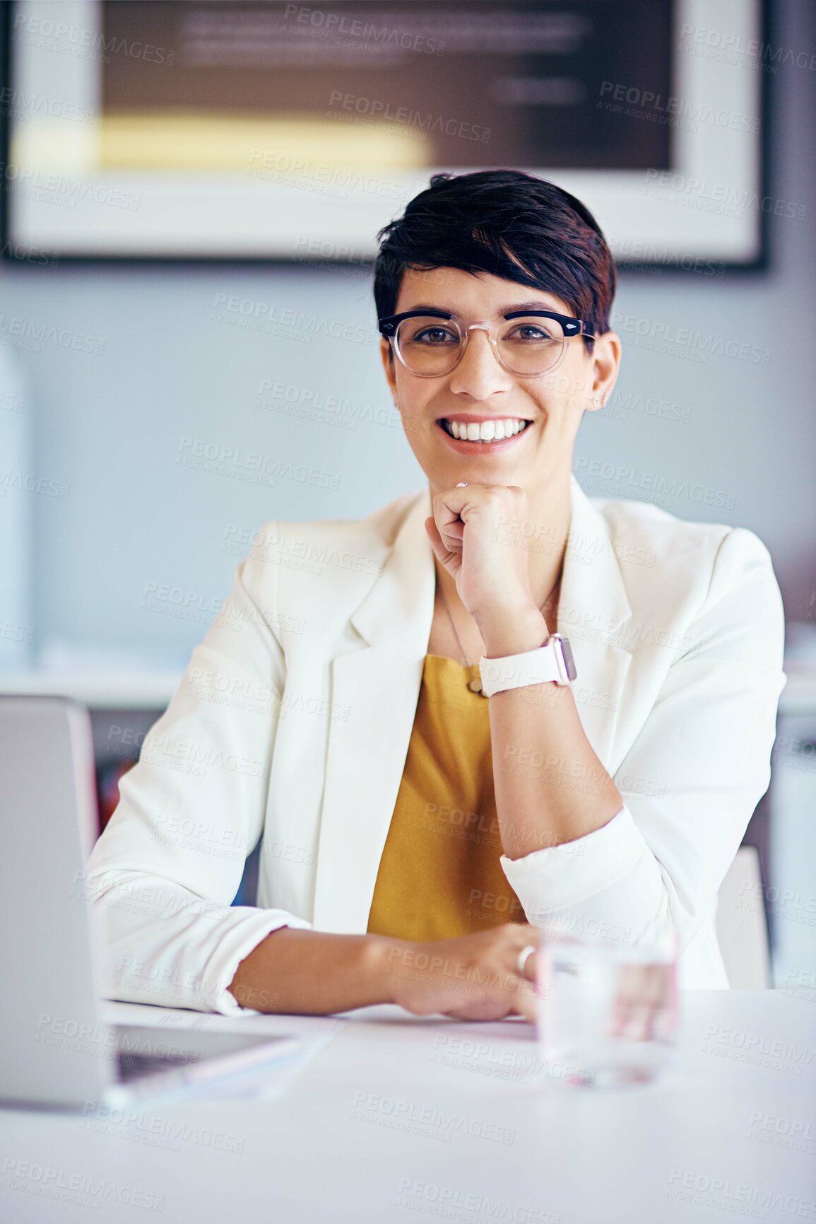 Buy stock photo Portrait of a young businesswoman working at her desk