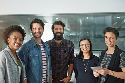 Buy stock photo Cropped portrait of a group of creative businesspeople standing in their office