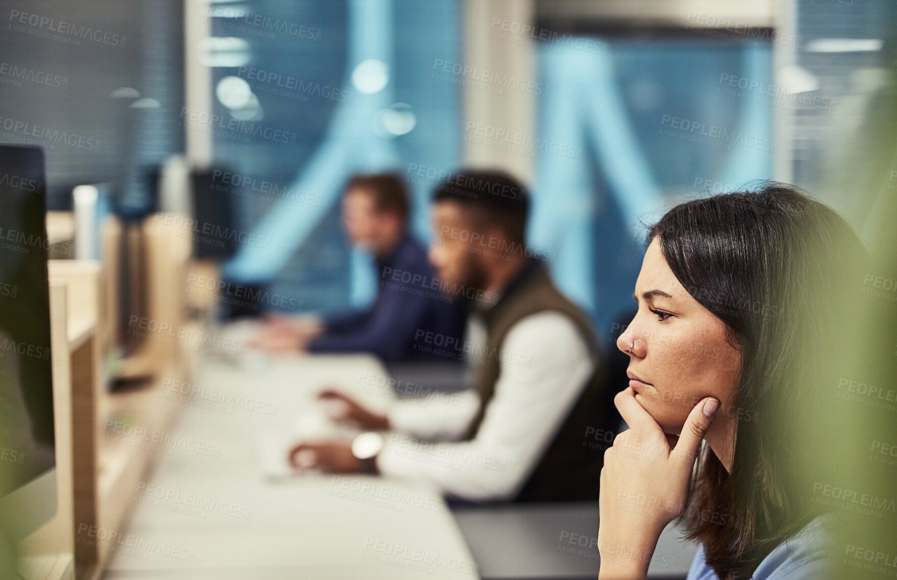 Buy stock photo Shot of a group of designers working on computers in an office