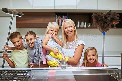 Buy stock photo Portrait of a mother and her kids doing chores together at home