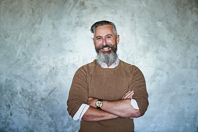 Buy stock photo Portrait of a confident middle aged man standing with his arms folded against a grey background