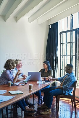 Buy stock photo Shot of a diverse group of businesspeople having a meeting in a modern office