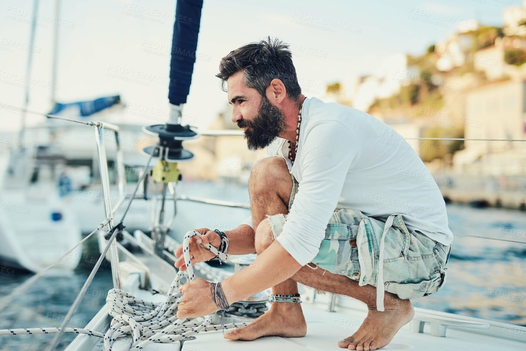 Buy stock photo Shot of a mature man out sailing on a sunny morning