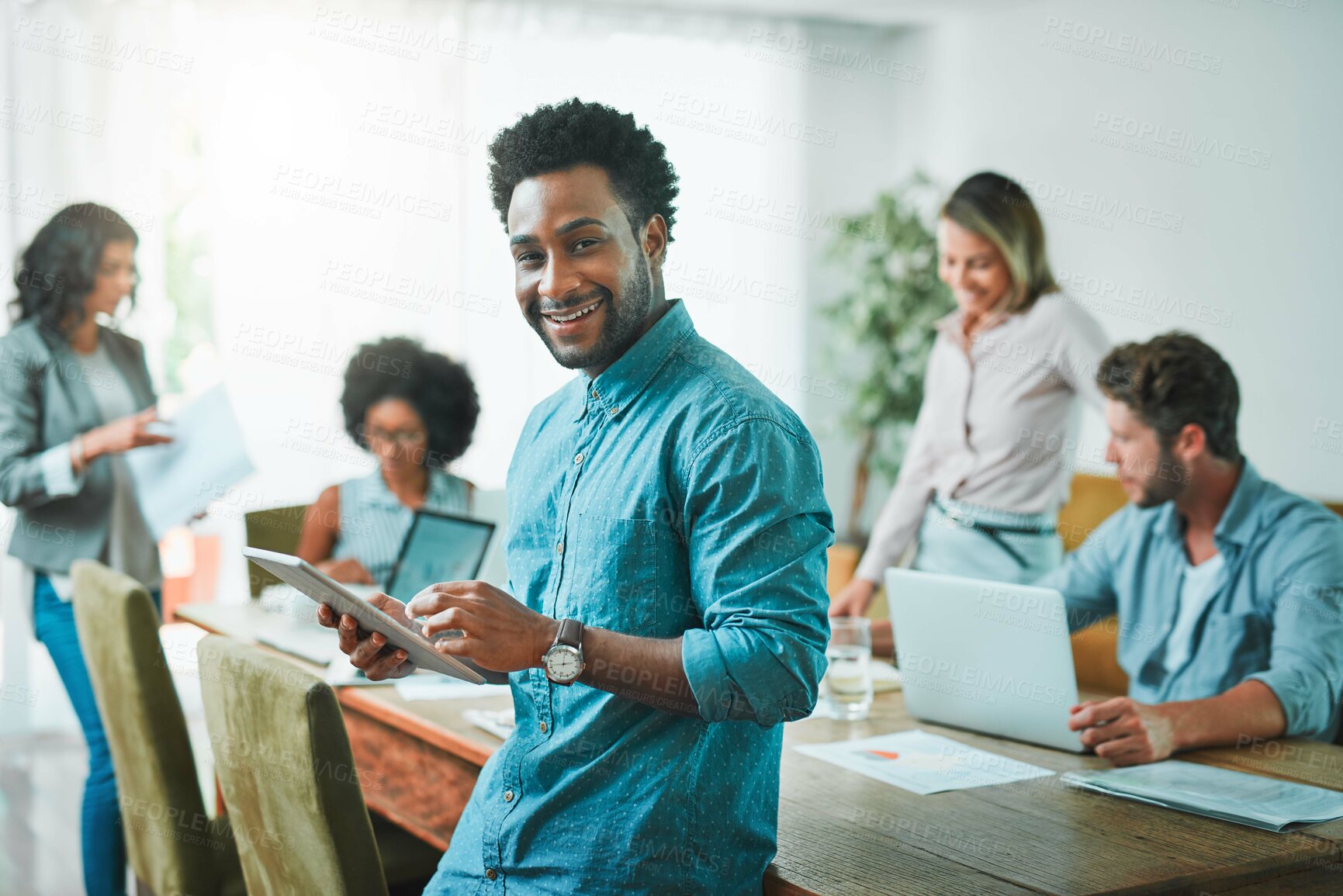 Buy stock photo Shot of young designers working in a modern office