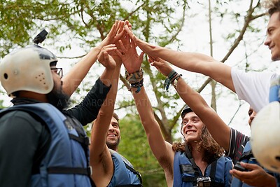 Buy stock photo Cropped shot of a group of young male friends giving each other a high five before they go white water rafting