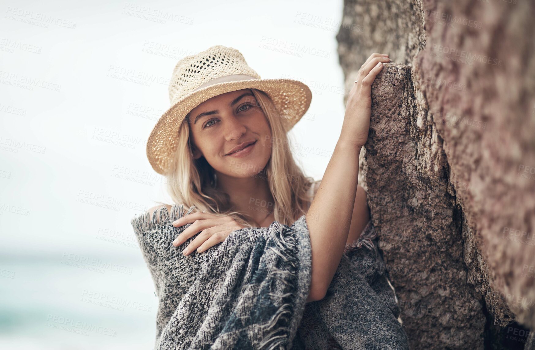 Buy stock photo Shot of a beautiful young woman spending the day at the beach