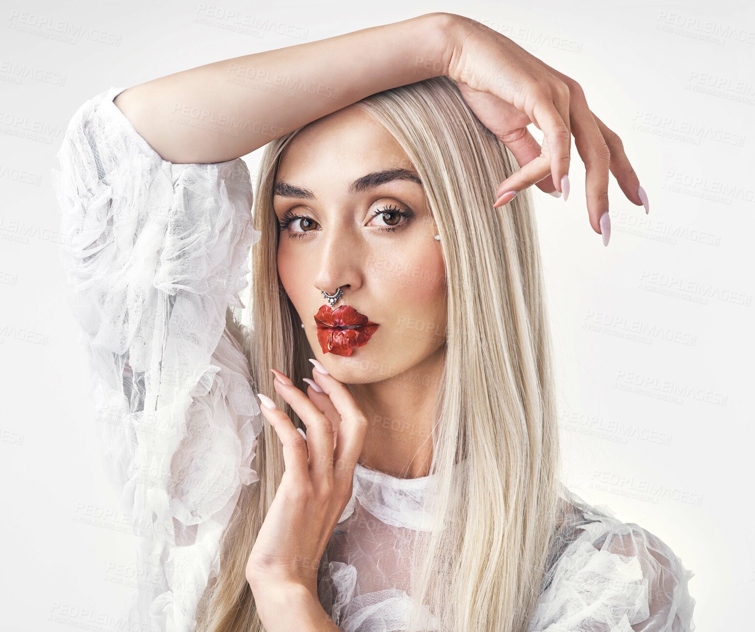 Buy stock photo Portrait of an attractive young woman displaying her tattoos against a white background