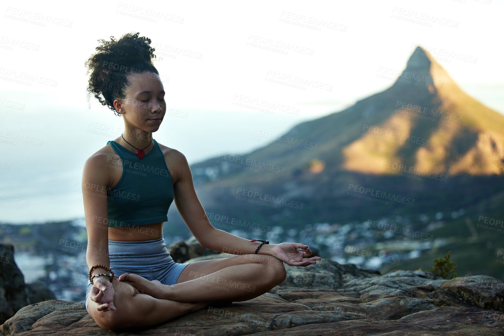 Buy stock photo Woman, mediation and yoga on a mountain with wellness in cape town for fitness and health. Female hiker, calm and meditating on a cliff in the outdoor with nature cityscape for healthy body.