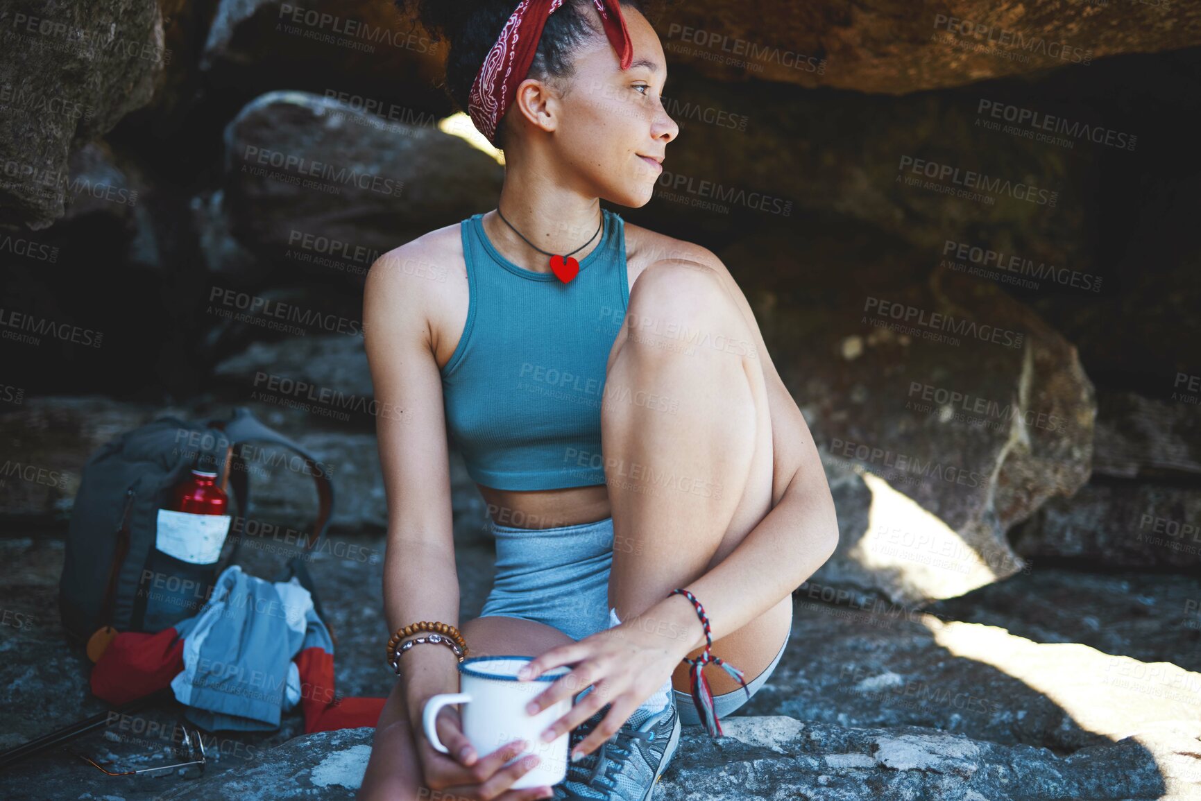 Buy stock photo Shot of a woman holding a coffee mug while out in the mountains