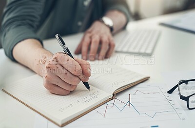 Buy stock photo Sot of an unrecognizable man writing in a book at work