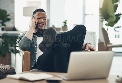 Buy stock photo Shot of a young business man on a phone call in a modern office