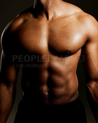 Buy stock photo Studio shot of a fit man posing against a black background