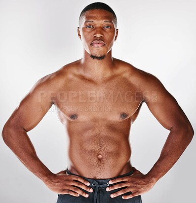 Buy stock photo Studio portrait of a shirtless handsome young man posing against a white background