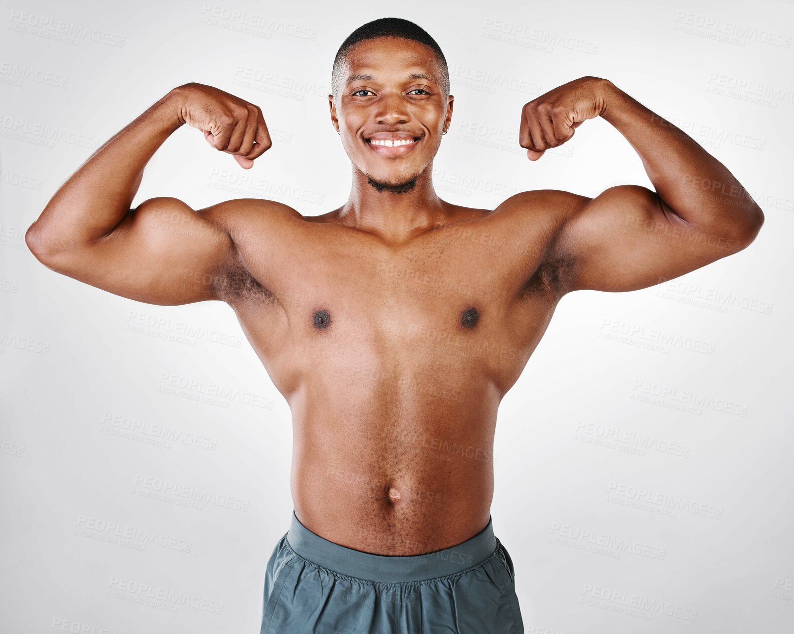 Buy stock photo Studio portrait of a shirtless handsome young man posing against a white background