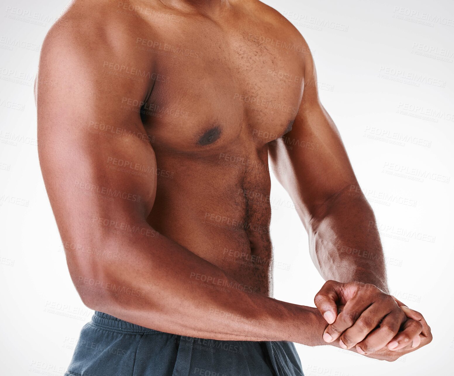 Buy stock photo Cropped studio shot of a shirtless muscular man posing against a white background