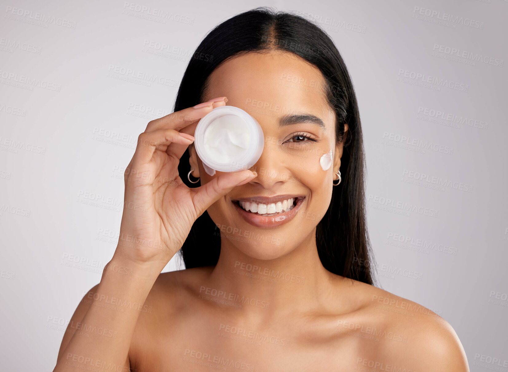 Buy stock photo Happy woman, portrait and cream product for skincare, beauty or cosmetics against a grey studio background. Face of female person smiling for lotion, creme or cosmetic moisturizer or facial treatment