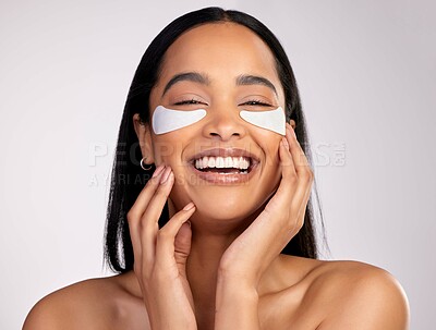 Buy stock photo Happy woman, portrait smile and eye mask in skincare, collagen or dermatology against a grey studio background. Face of female person or model smiling in beauty cosmetics, patches or facial treatment