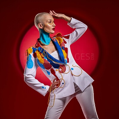 Buy stock photo Studio shot of a stylish young woman posing against a red background