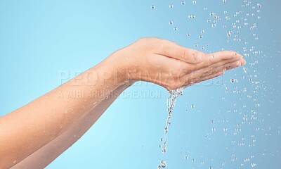 Buy stock photo Hands, cleaning and woman in shower for water splash, wellness and hygiene against blue background mockup. Hands, water and girl model relax with beauty splash, washing and grooming on studio mock up