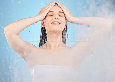 Buy stock photo Hair, cleaning and water steam with woman in a shower for hygiene, grooming and wellness on blue background. Hair care, beauty and girl in a bathroom for washing, body care and shampoo product