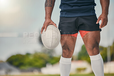 Buy stock photo Rugby, man and ball, zoom on legs of strong, muscular male  ready at winning game on field. Fitness, sports and professional sport player at practice match, workout or competition on grass at stadium