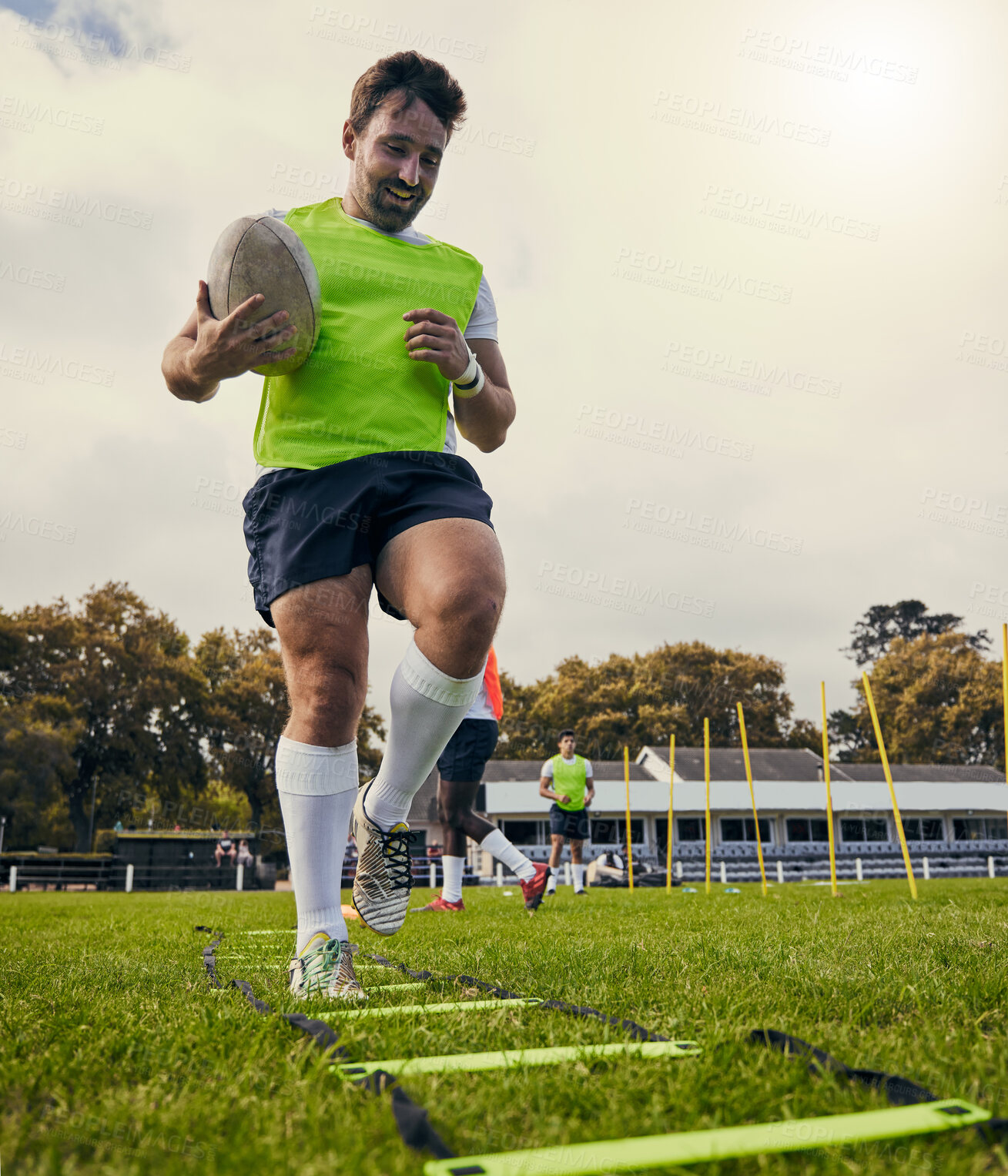 Buy stock photo Rugby, sports and man training on field with equipment ready for match, practice and sport games. Fitness, performance and happy male athlete running for warm up, exercise and workout for competition