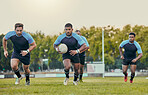 Rugby, team and men training, playing on grass field and exercise for healthy lifestyle, balance and wellness. Male players, athletes and guys outdoor, competition and match for fitness and practice