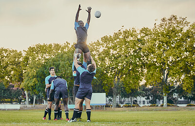 Buy stock photo Sport, men and rugby and jump with team on field, playing game with energy and fitness, ball and action outdoor. Training, exercise and professional match, sports club with male group and active