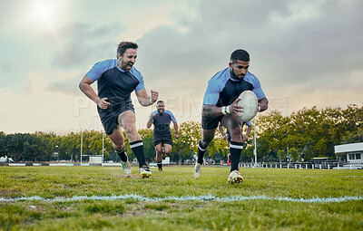 Buy stock photo Rugby, sports and men training, score and exercise for balance, endurance and workout for wellness. Team, male athletes or players with ball, victory or winning on grass field, competition and active