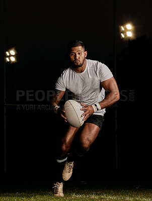 Buy stock photo Rugby, night and man running with ball to score goal at dark stadium at game, match or practice workout. Sports, fitness and motion, player with action on grass with energy and skill in team sport.