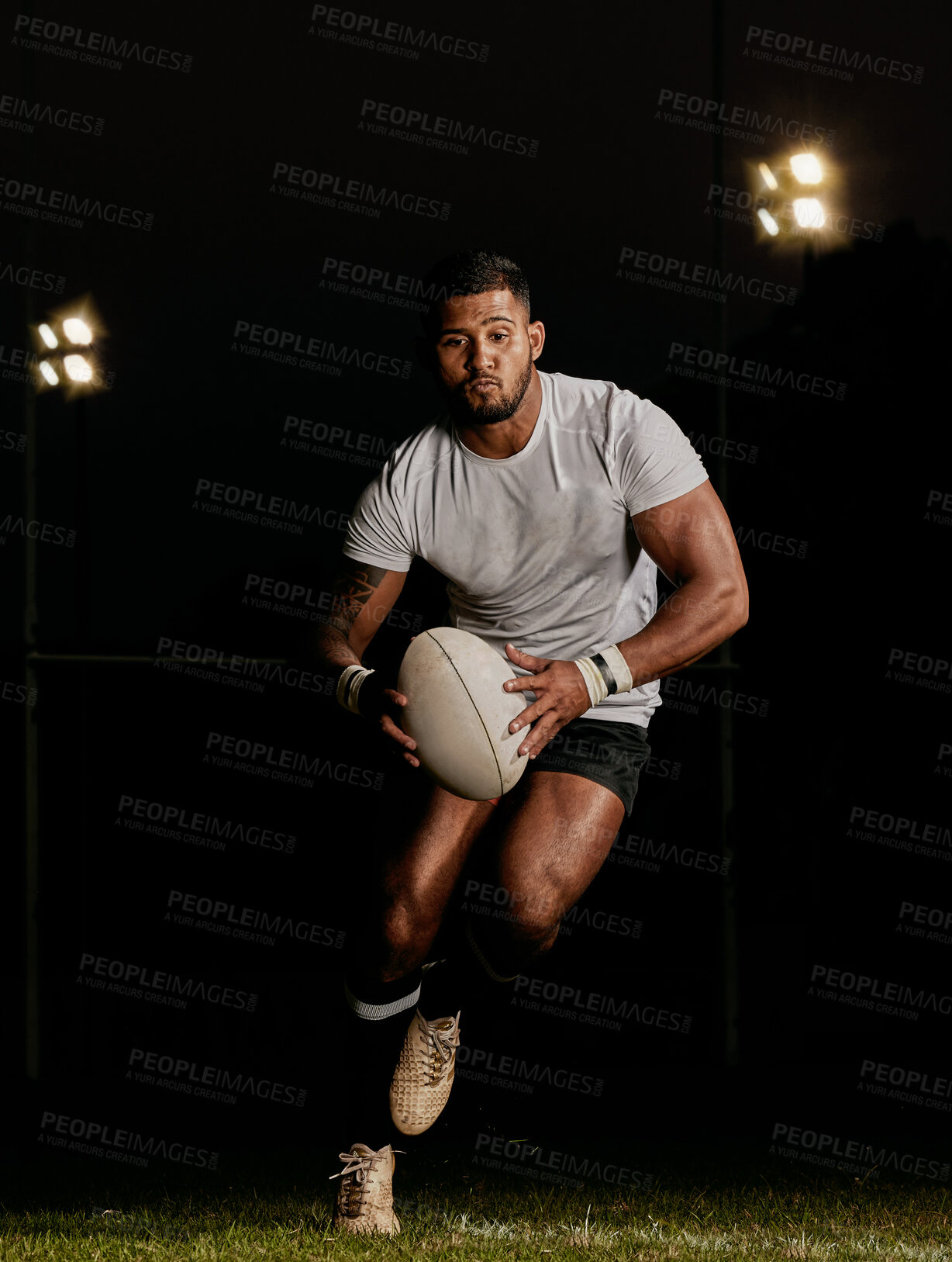 Buy stock photo Rugby, night and man running with ball to score goal at dark stadium at game, match or practice workout. Sports, fitness and motion, player with action on grass with energy and skill in team sport.