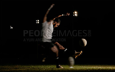 Buy stock photo Rugby, night and man kicking ball to score goal at dark stadium at game, match or practice workout. Sports, fitness and motion, player with blurred action on grass with energy and skill in team sport