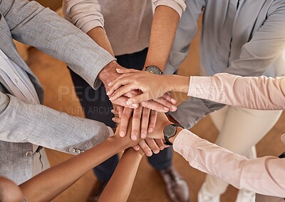 Buy stock photo Business people, hands and teamwork in collaboration above for meeting trust, unity and community at office. Top view of group piling hand together for celebration, success or workplace team building