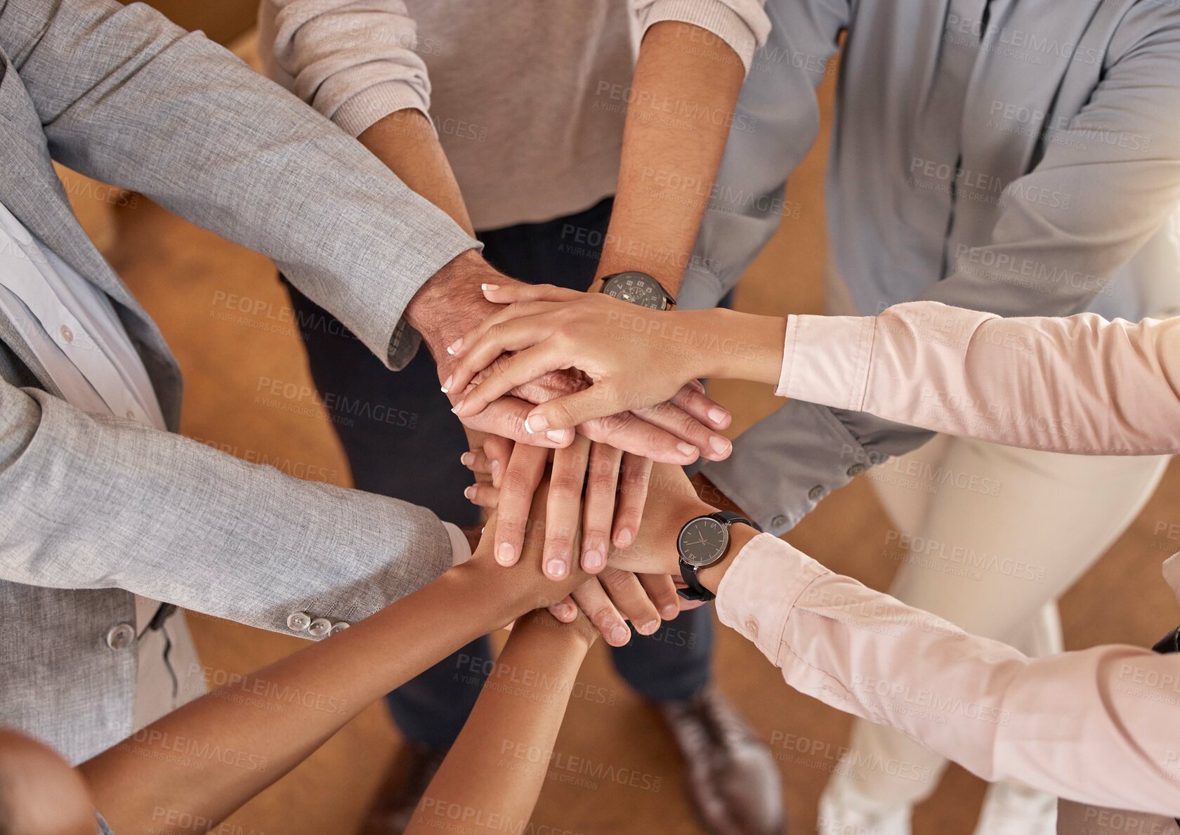 Buy stock photo Business people, hands and teamwork in collaboration above for meeting trust, unity and community at office. Top view of group piling hand together for celebration, success or workplace team building