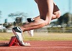 Start, running and speed with shoes of person on race track for fitness, sports and marathon training. Competition, health and workout with closeup of runner in stadium for energy and performance