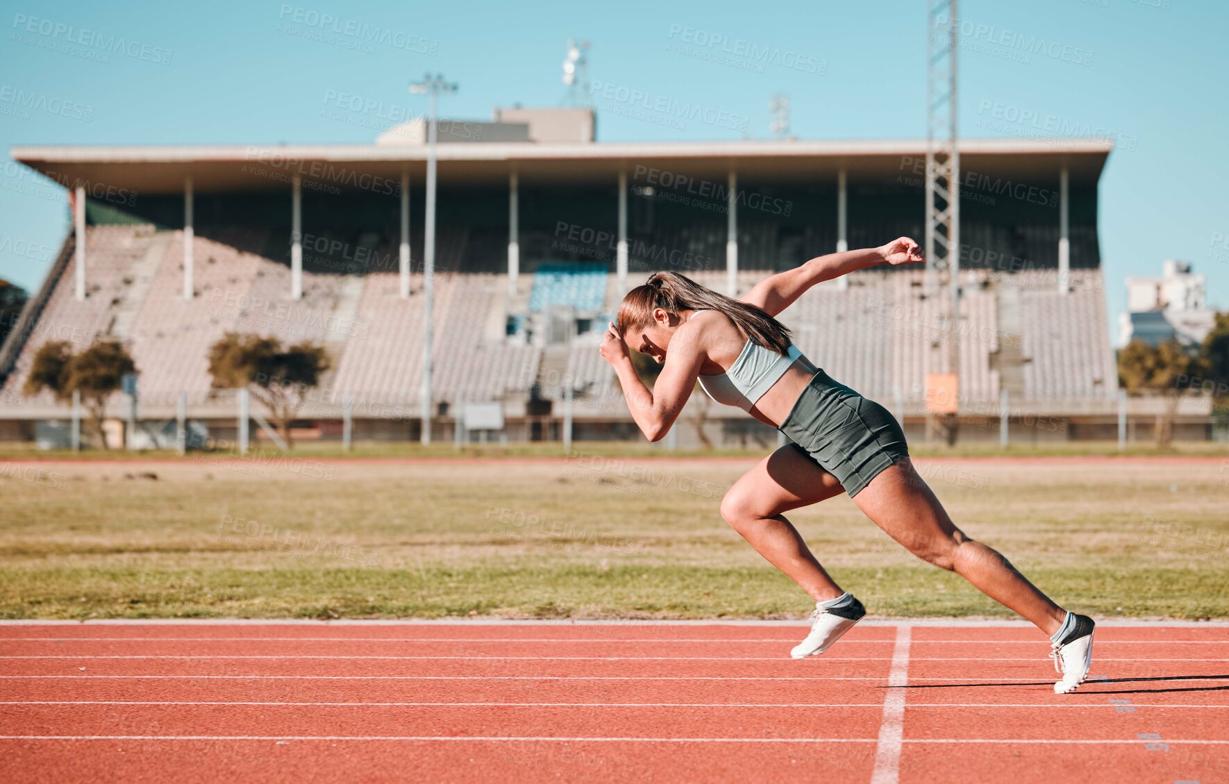 Buy stock photo Sports, race and woman athlete running sprint in competition for fitness game or training as energy wellness on a track. Fast, stadium and athletic person or runner exercise, speed and workout