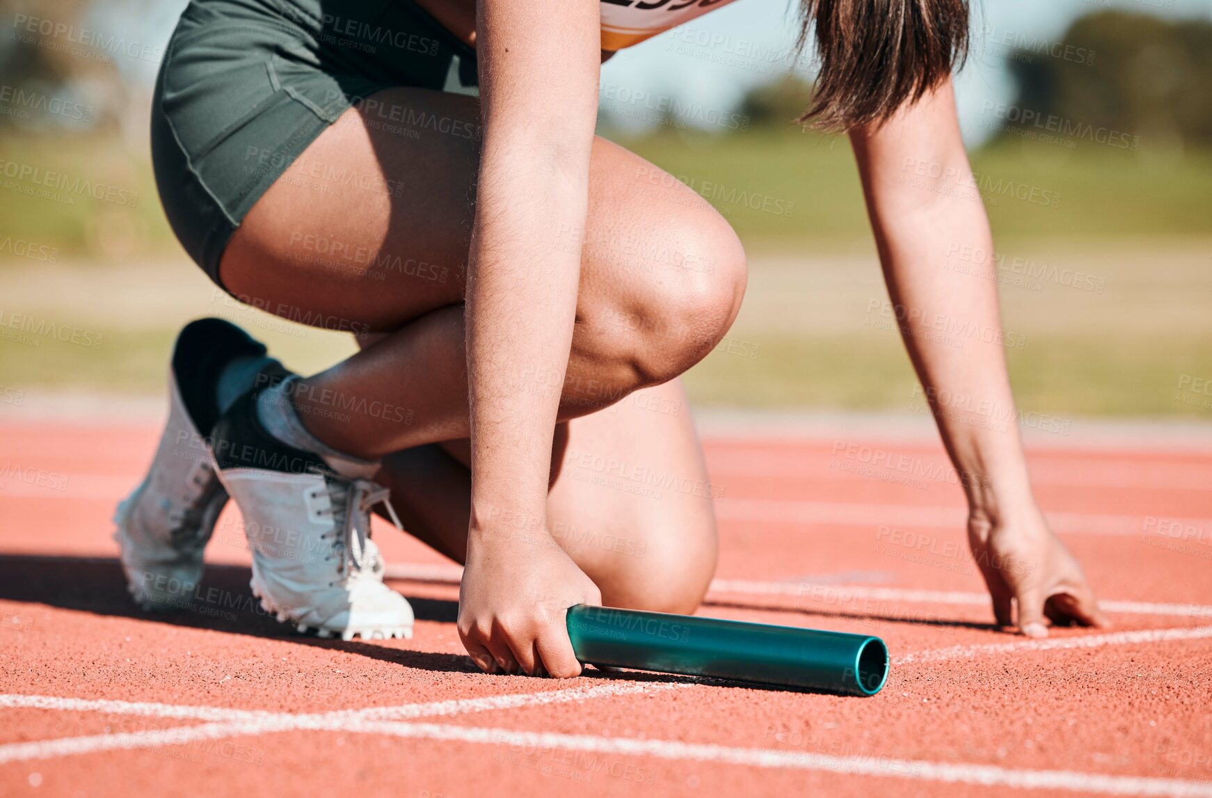 Buy stock photo Start, running and relay with hands of person on race track with baton for sports, competition and marathon. Exercise, health and wellness with closeup of runner in stadium for challenge and athlete