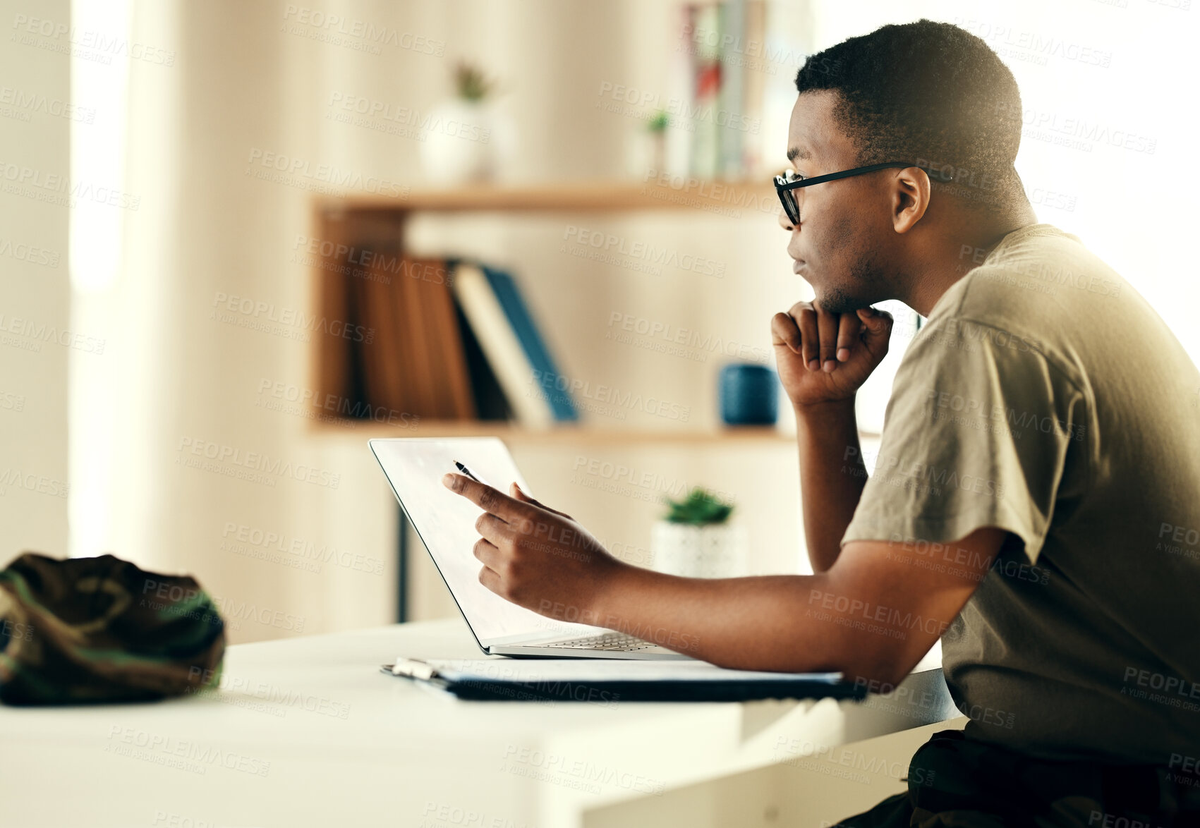 Buy stock photo Black man, laptop and reading military information, planning or army surveillance indoor at base. Computer, soldier and concentration on web research at data center for cyber security and protection