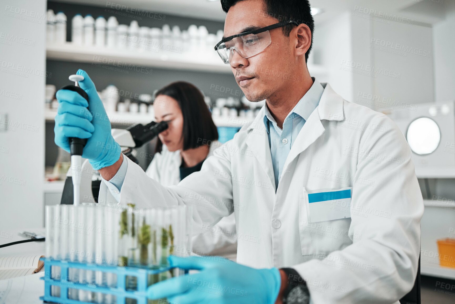 Buy stock photo Science, research and man with test tube in biotech laboratory, solution for vaccine or medical innovation. Healthcare, lab analytics and medicine, scientist with pharmaceutical sample in container.