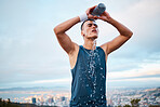 Fitness, water and fatigue with a sports man outdoor, tired after running a marathon for cardio training. Exercise, health and an exhausted young runner pouring liquid for hydration or refreshment