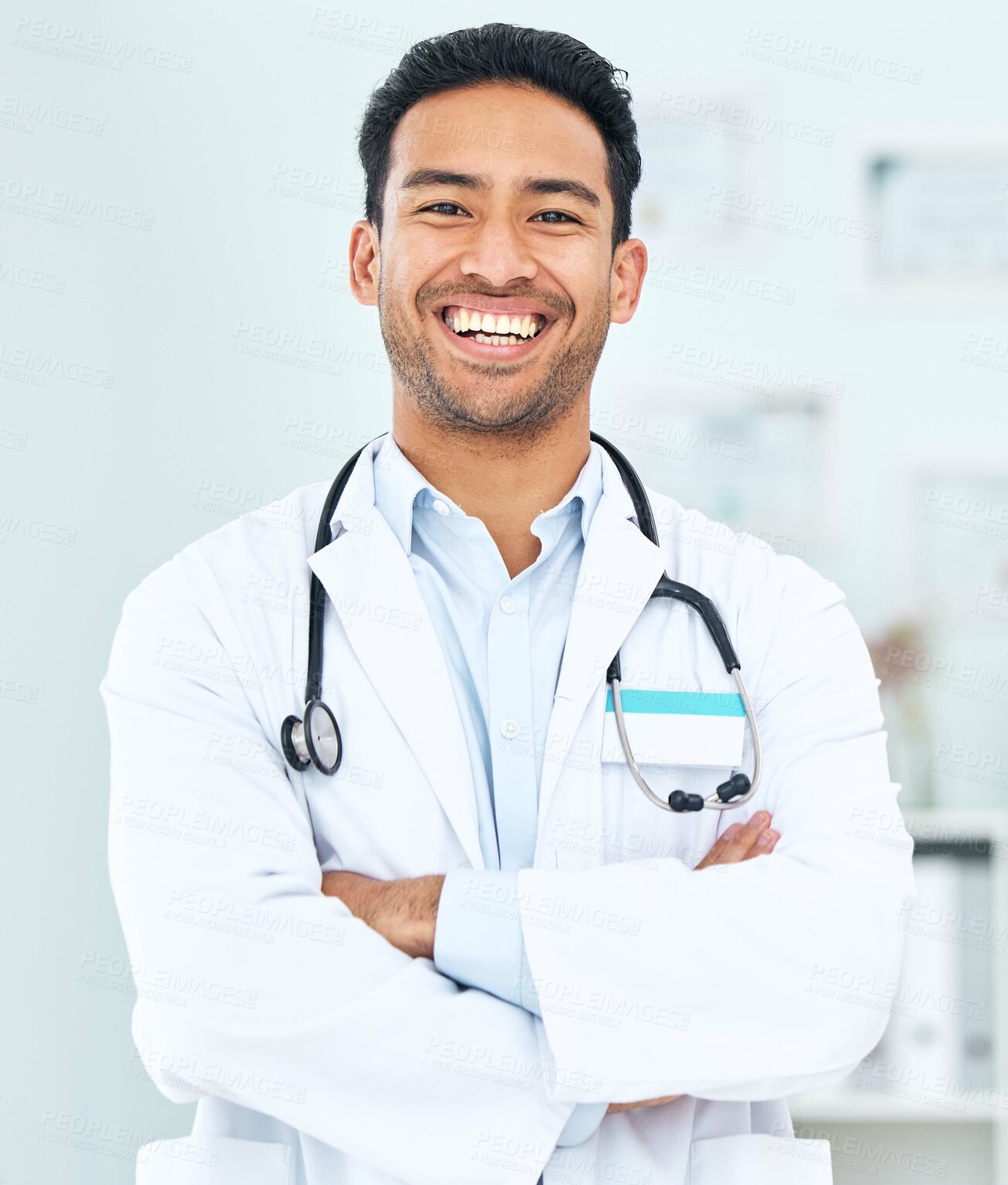 Buy stock photo Portrait of doctor with smile, arms crossed and healthcare, professional in hospital for support and help. Medicine, happy man with confidence and pride in medical career, expert surgeon in clinic.