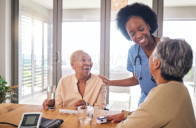 Buy stock photo Doctor with senior women at table in nursing home for consultation, check up and conversation. Nurse, caregiver or medical professional with elderly patient in living room for advice, chat and care