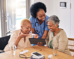 Tablet, smile and an assisted living nurse with old women in the kitchen of a retirement home for consulting. Technology, medical and an african caregiver showing information to patient friends