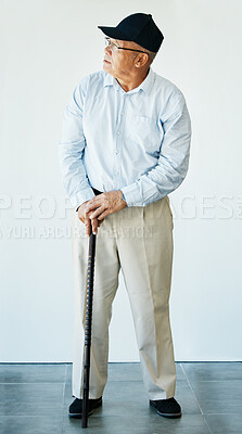 Buy stock photo Mature, person and walking stick while thinking with health, recovery and rehabilitation for assistance. Elderly, man or grandfather at medical office for doctor appointment, diagnosis or results