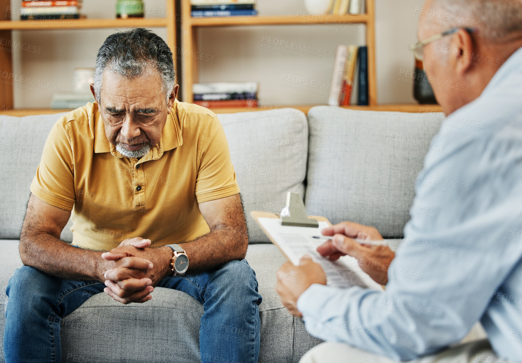 Buy stock photo Senior man talking to a therapist at a mental health, psychology and therapy clinic for session. Psychologist with clipboard for counseling checklist with elderly male patient in retirement in office