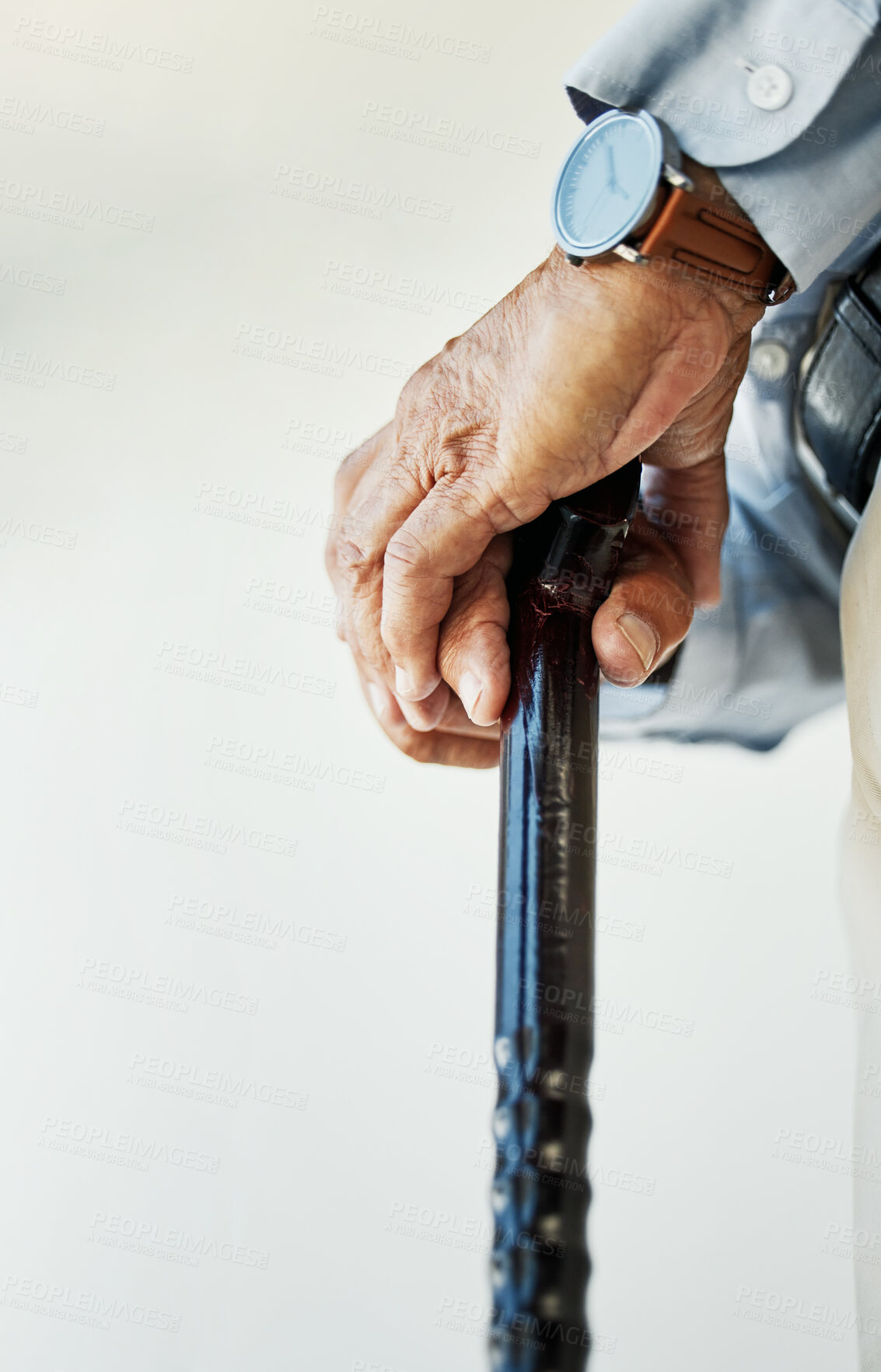 Buy stock photo Elderly, person and hand with walking stick in closeup for assistance, walk or health in nursing home. Wrinkles, fingers and hold on blurred background for retirement, support or wellness in facility