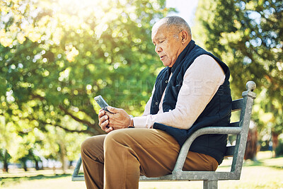 Buy stock photo Senior man, garden and browsing on phone for social media, learning and network with internet or technology on park bench, nature and outdoors. Elderly person, email and chat on smartphone or mobile